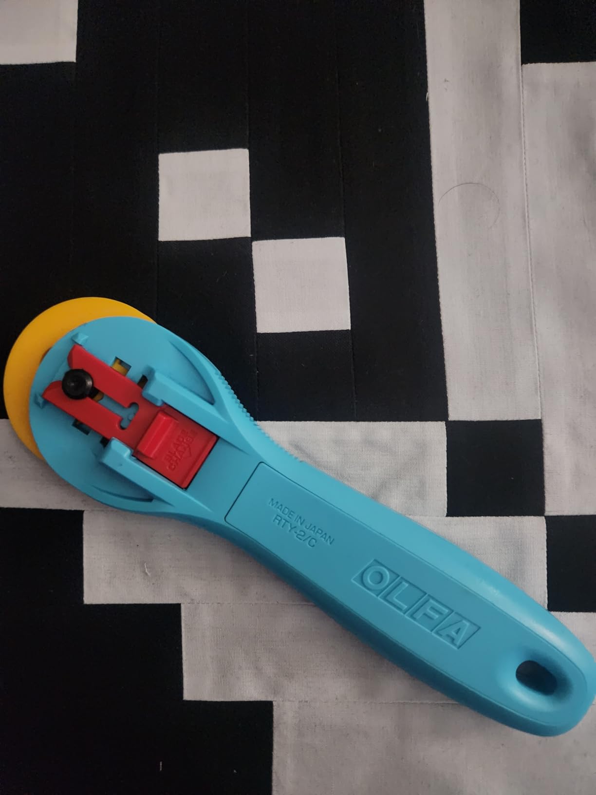 OLFA 45mm Quick-Change Rotary Cutter (RTY-2/C) - Rotary Fabric Cutter w/Blade Cover for Crafts, Sewing, Quilting (Aqua) customer photo 1