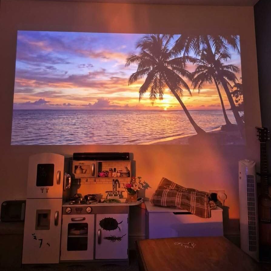Smart Projector [Google TV Official Licensed & 4K Support] with WiFi and Bluetooth, Portable Mini Movie Short Throw Projector Outdoor with Built-in Apps Auto Focus Keystone for Home Bedroom Ceiling customer photo 2
