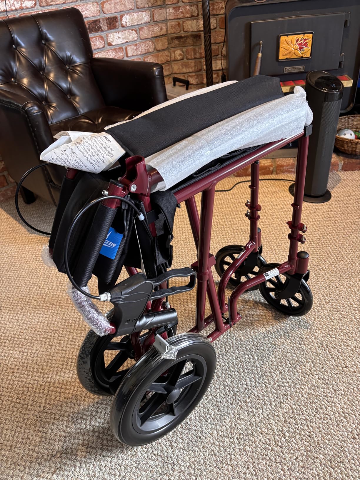 Medline Lightweight Foldable Transport Wheelchair with Handbrakes and 12-Inch Wheels, Red Frame, Black Upholstery customer photo 2